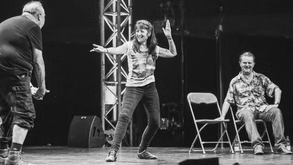 Suki on stage bw 16 9 Suki on stage bw 16 9